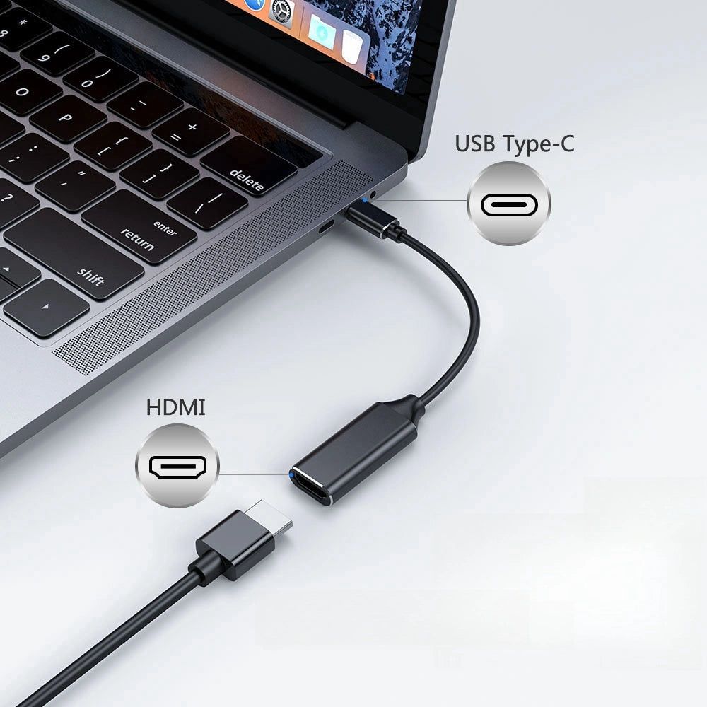 USB-C naar HDMI adapter aangesloten op laptop en extern beeldscherm